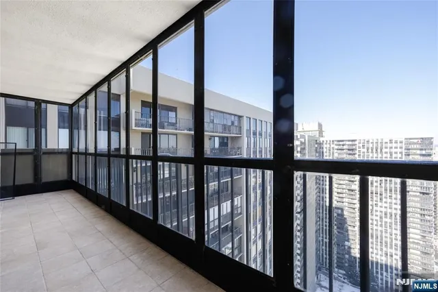 a view of staircase with wooden floor and fence