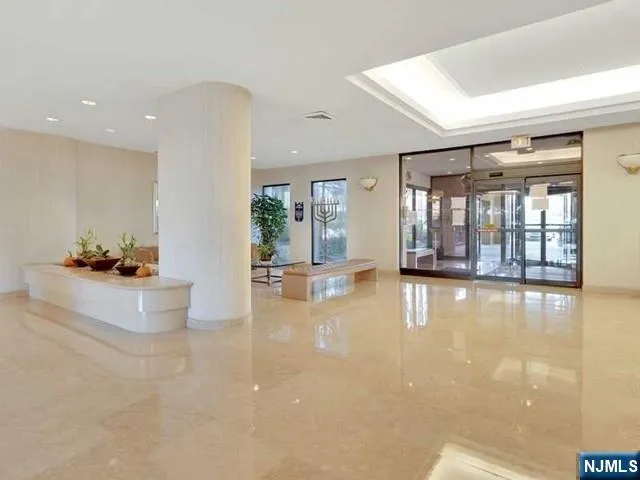 a view of a living room and chandelier