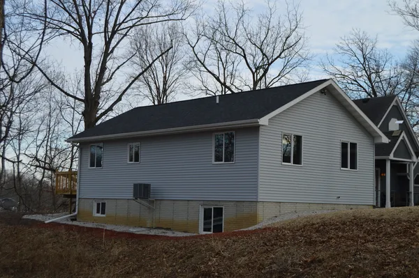 a view of a house with a yard