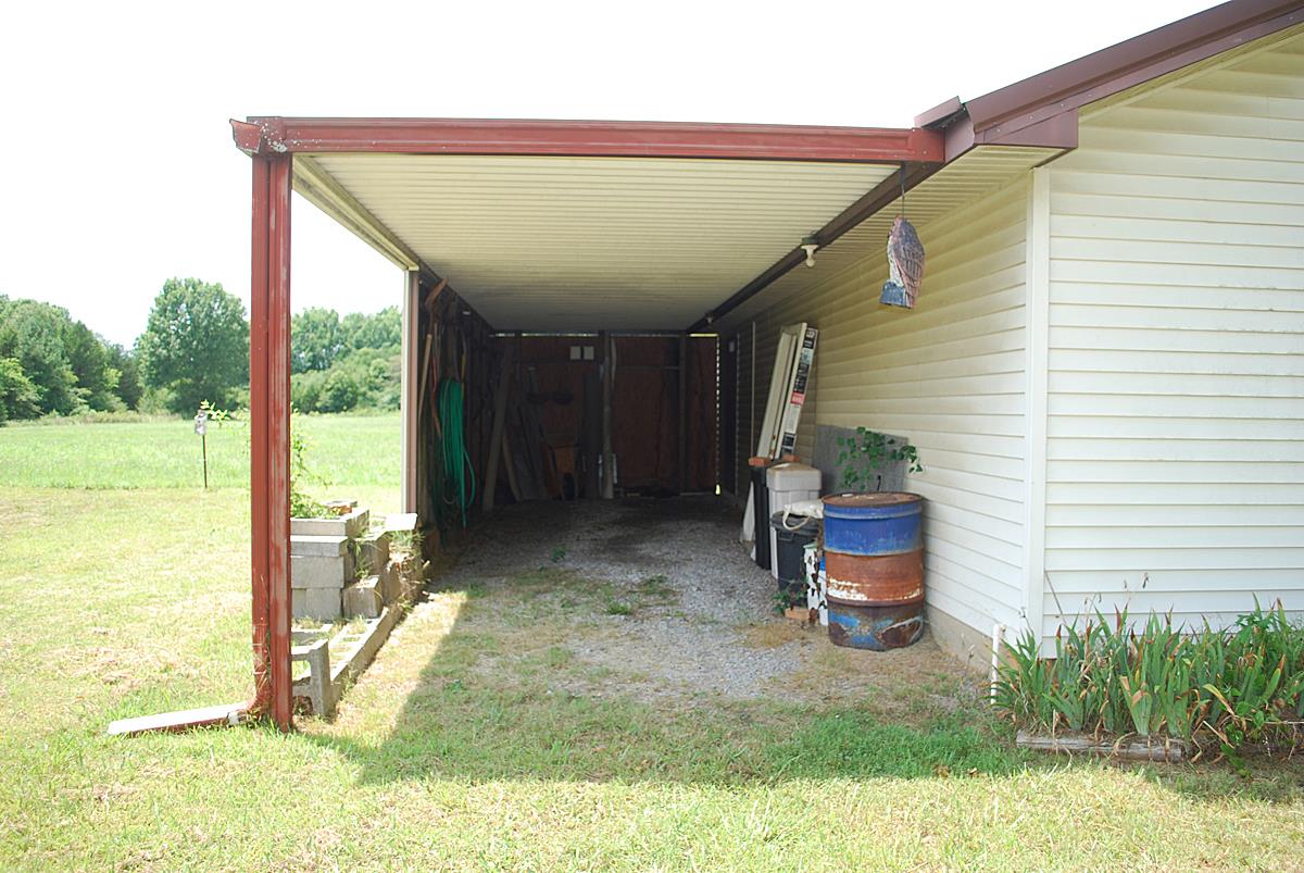 178 Taylor Road Rockvale, TN 37153 - Photo 14 of 25 a backyard of a house with seating space