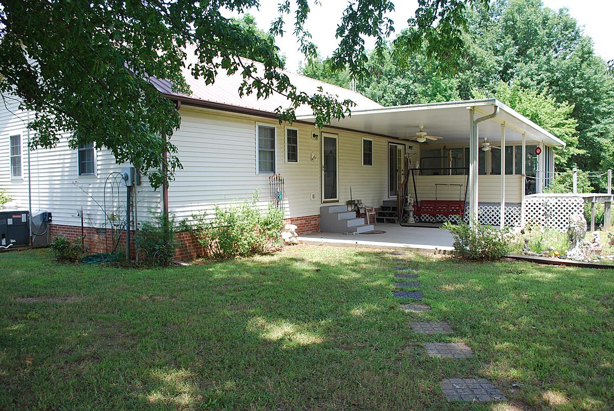 178 Taylor Road Rockvale, TN 37153 - Photo 8 of 25 a front view of house with yard barbeque and outdoor seating