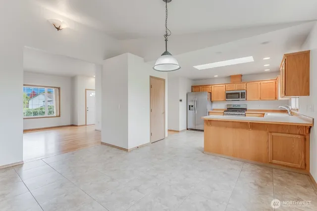 a kitchen that has a lot of cabinets in it