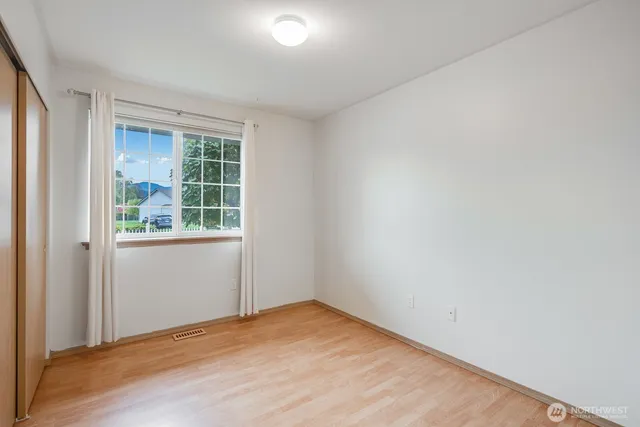 a bathroom with a sink a toilet and vanity