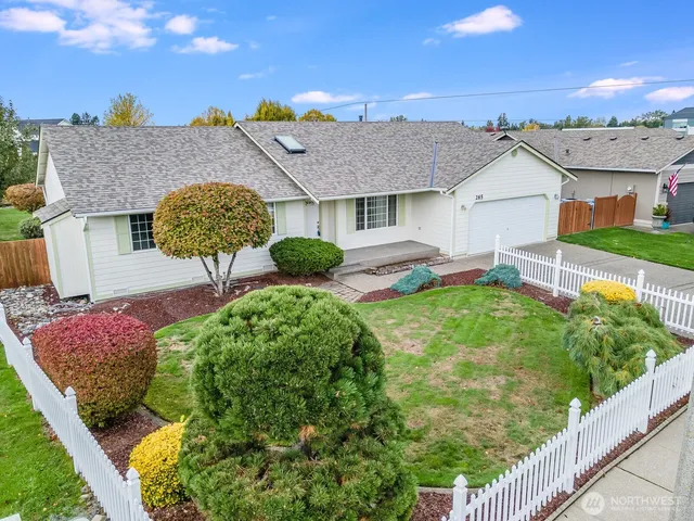 a view of outdoor space with garden and trees