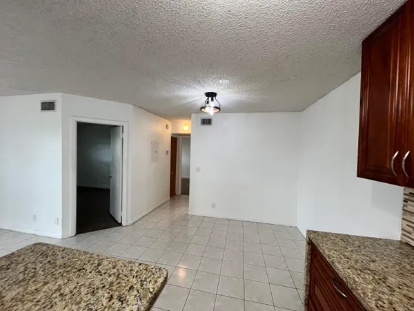 a view of a kitchen cabinets and wooden floor