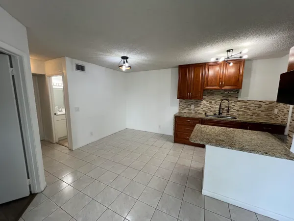 a view of living room with granite countertop furniture and fireplace