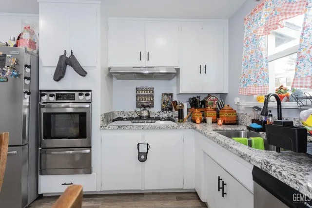 a kitchen with a stove and a sink