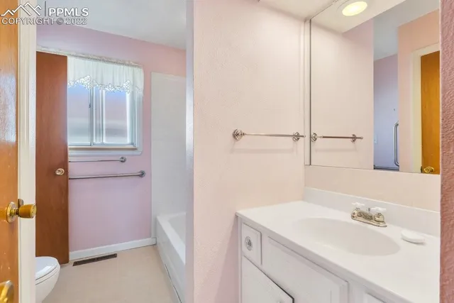 a utility room with sink dryer and washer