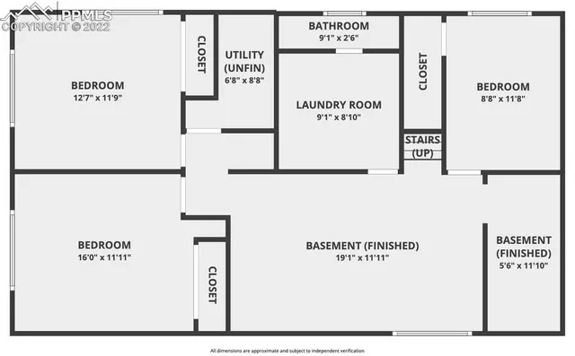 a view of an empty room and wooden floor