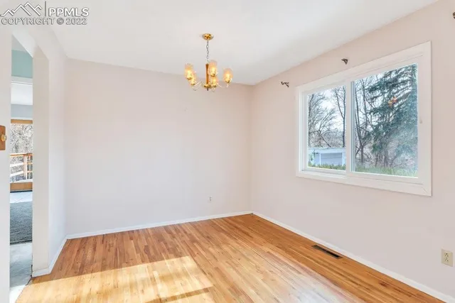 a kitchen with stainless steel appliances granite countertop a stove and a refrigerator
