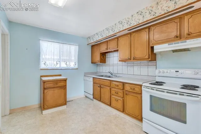 a bathroom with a sink vanity and mirror