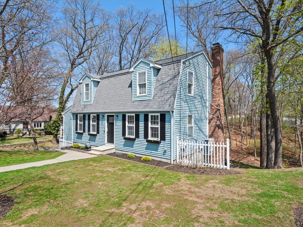 2 Stringer Dam Road Shrewsbury, MA 01545 - Photo 4 of 35 a front view of a building with a garden