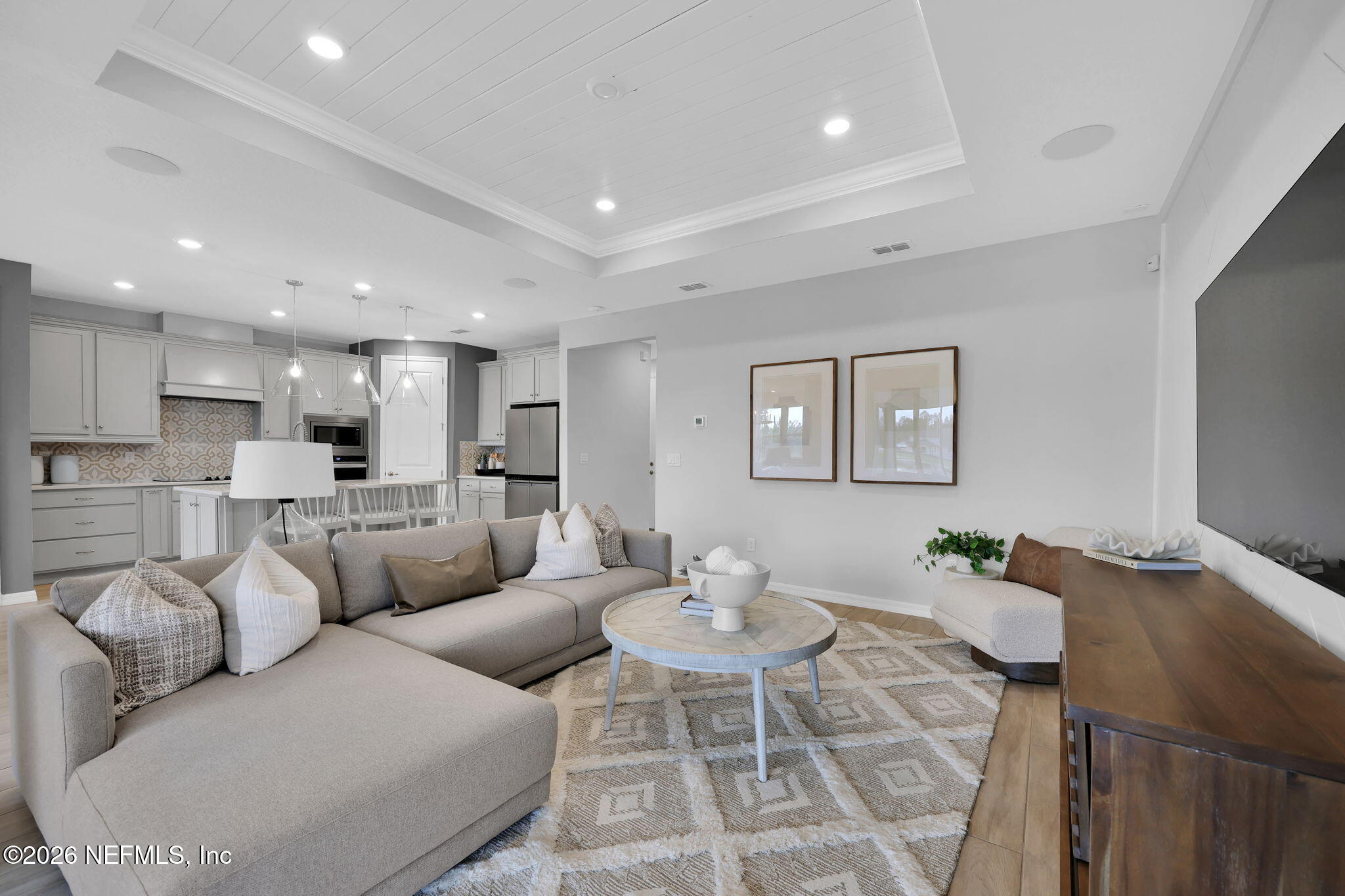 860 Rooster Holw Way Middleburg, FL 32068 - Photo 12 of 26 a living room with furniture white walls and kitchen view