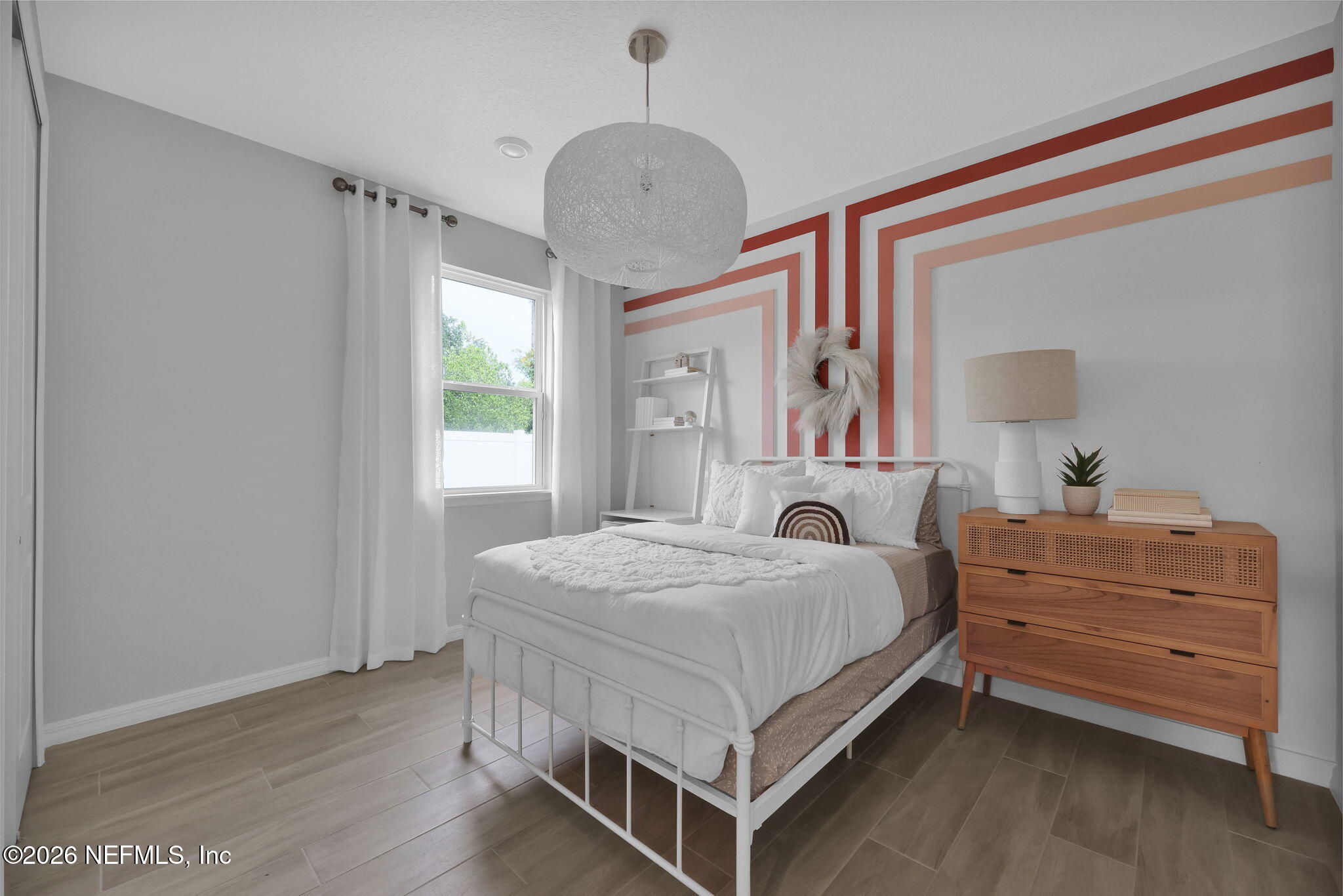 860 Rooster Holw Way Middleburg, FL 32068 - Photo 18 of 26 a bedroom with a bed and a dresser