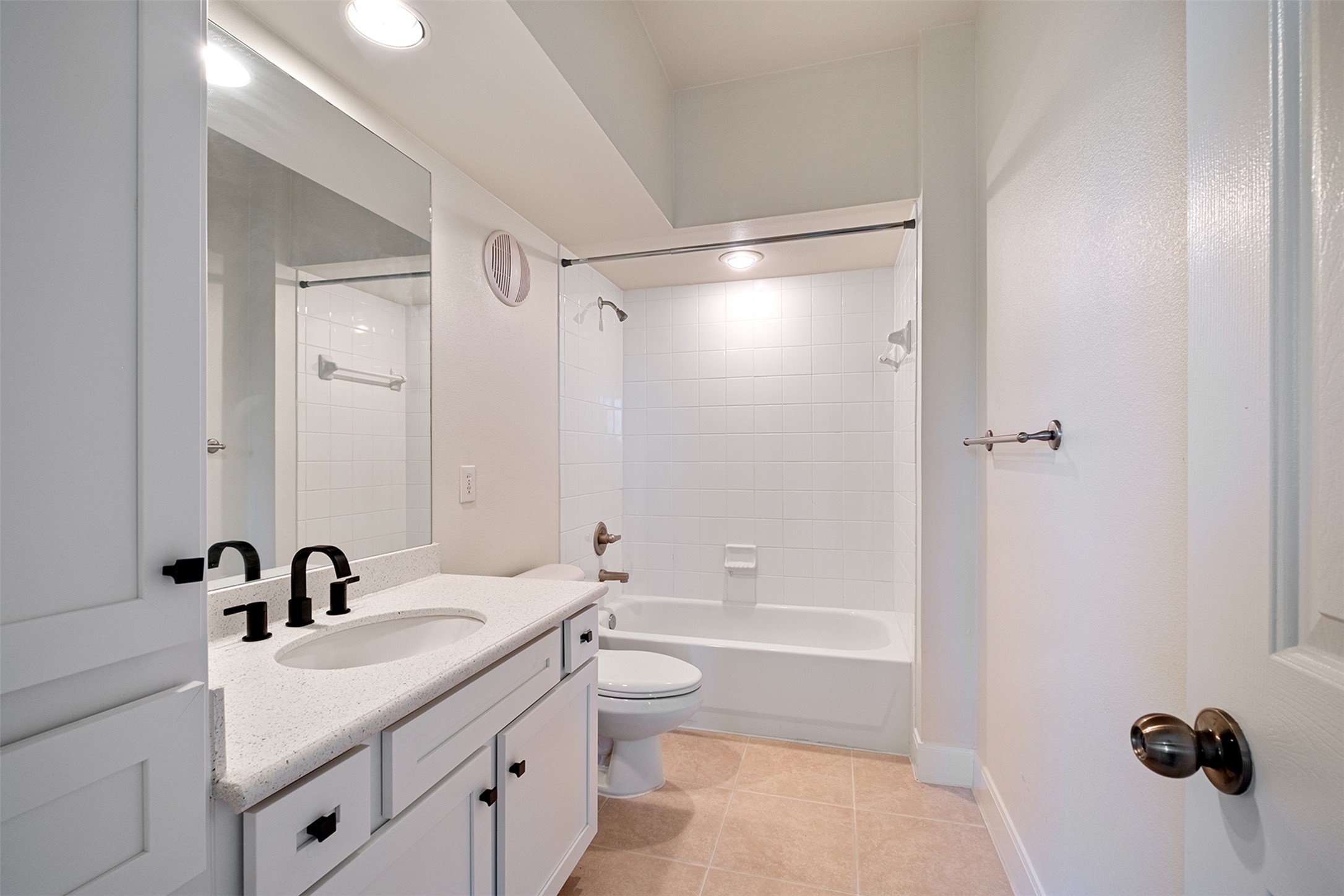 7701 Rialto Boulevard, Unit 637 Austin, TX 78735 - Photo 16 of 25 A pristine bathroom featuring a sleek vanity with ample counter space and a modern tub-shower combination.