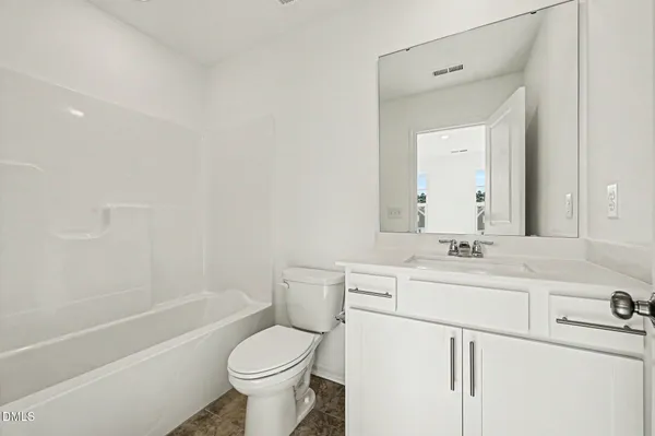a bathroom with 2 sink and a mirror