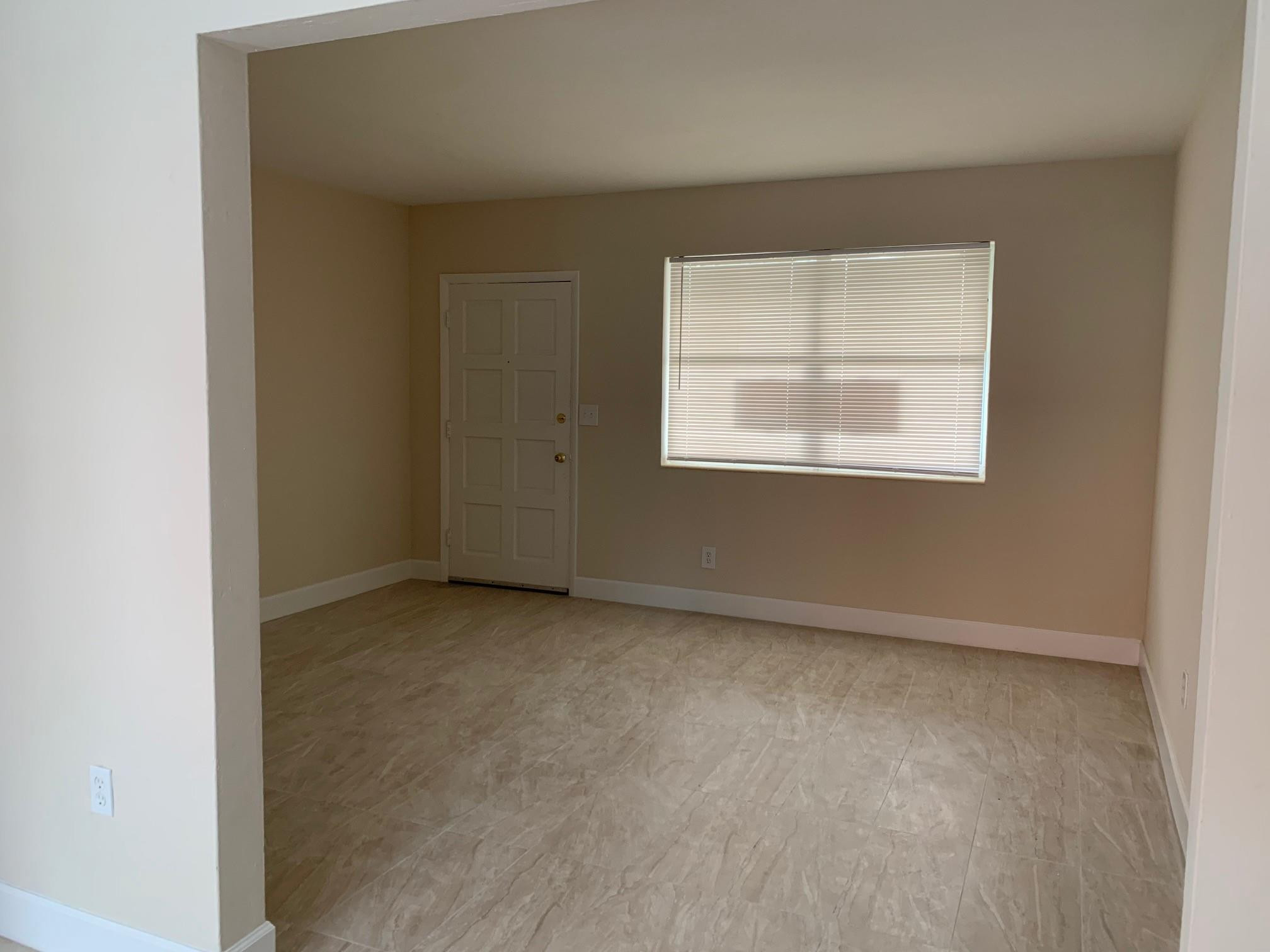 1575 Southwest 2nd Street, Unit 1 Miami, FL 33135 - Photo 3 of 10 an empty room with a window