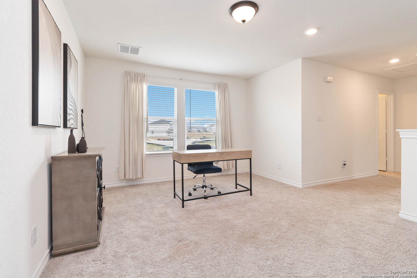 6611 Runaway Row Converse, TX 78109 - Photo 16 of 30 a living room with furniture a window and a fireplace