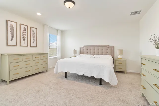 a bed room with a bed and furniture