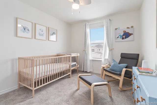 a bedroom with furniture and a window