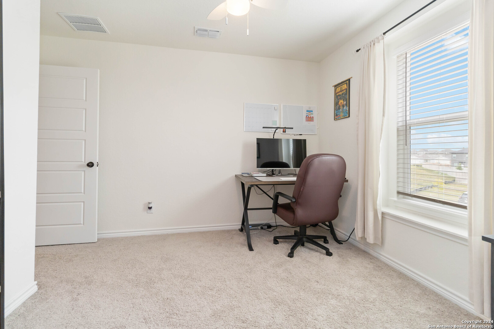 6611 Runaway Row Converse, TX 78109 - Photo 22 of 30 a view of a workspace with furniture and a window