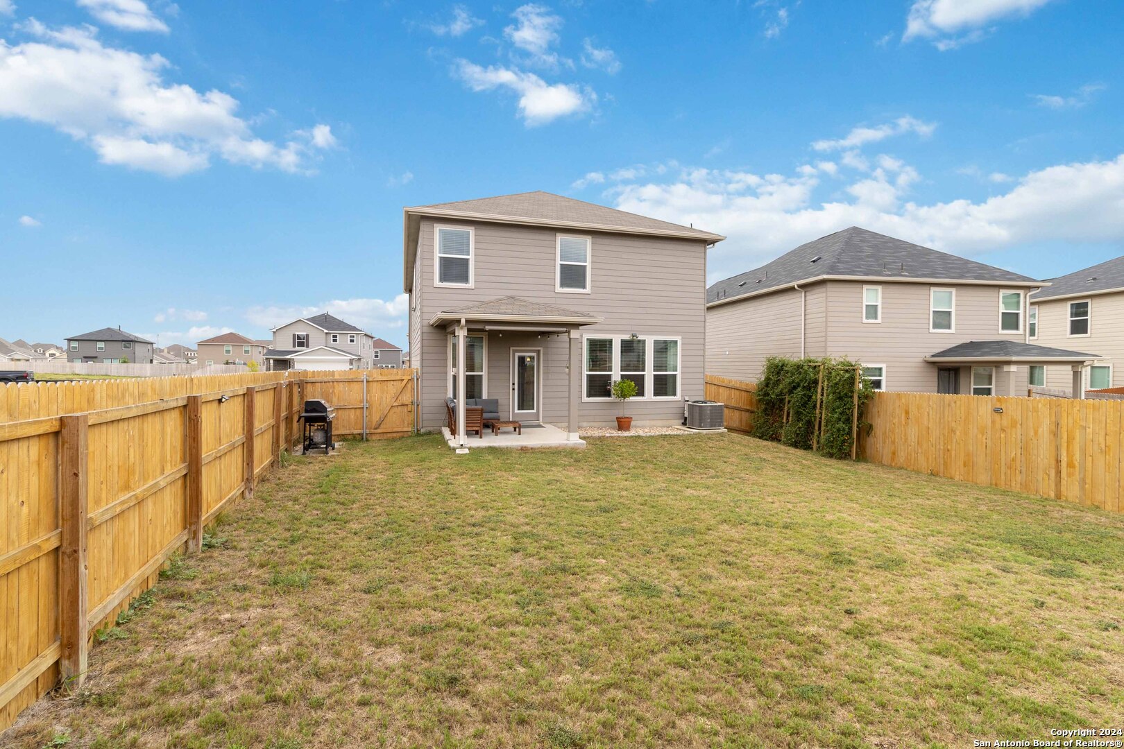 6611 Runaway Row Converse, TX 78109 - Photo 28 of 30 a front view of a house with a yard