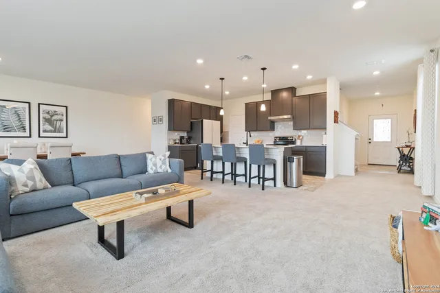 a living room with furniture and a table