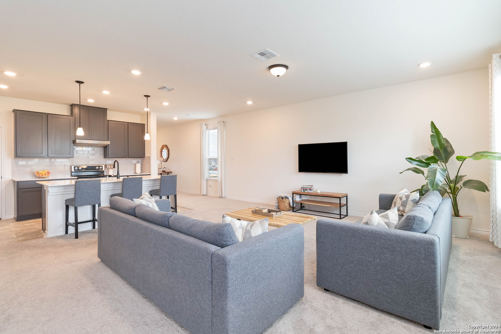 6611 Runaway Row Converse, TX 78109 - Photo 8 of 30 a living room with furniture and a flat screen tv