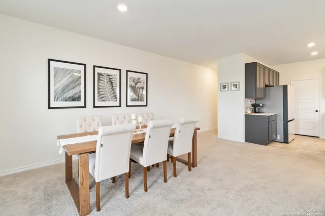 a view of a dining room with furniture