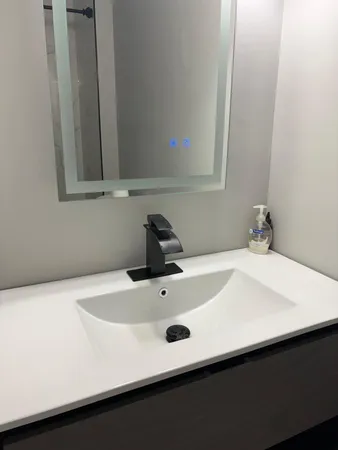 a bathroom with a sink and a vanity