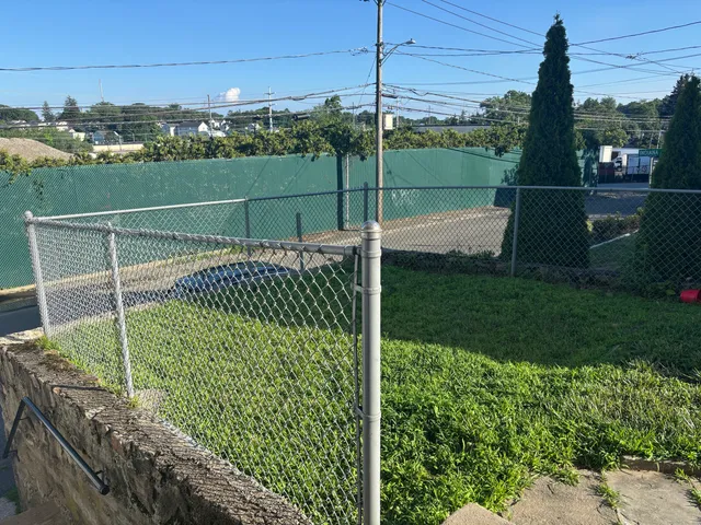 a view of a swimming pool with a yard