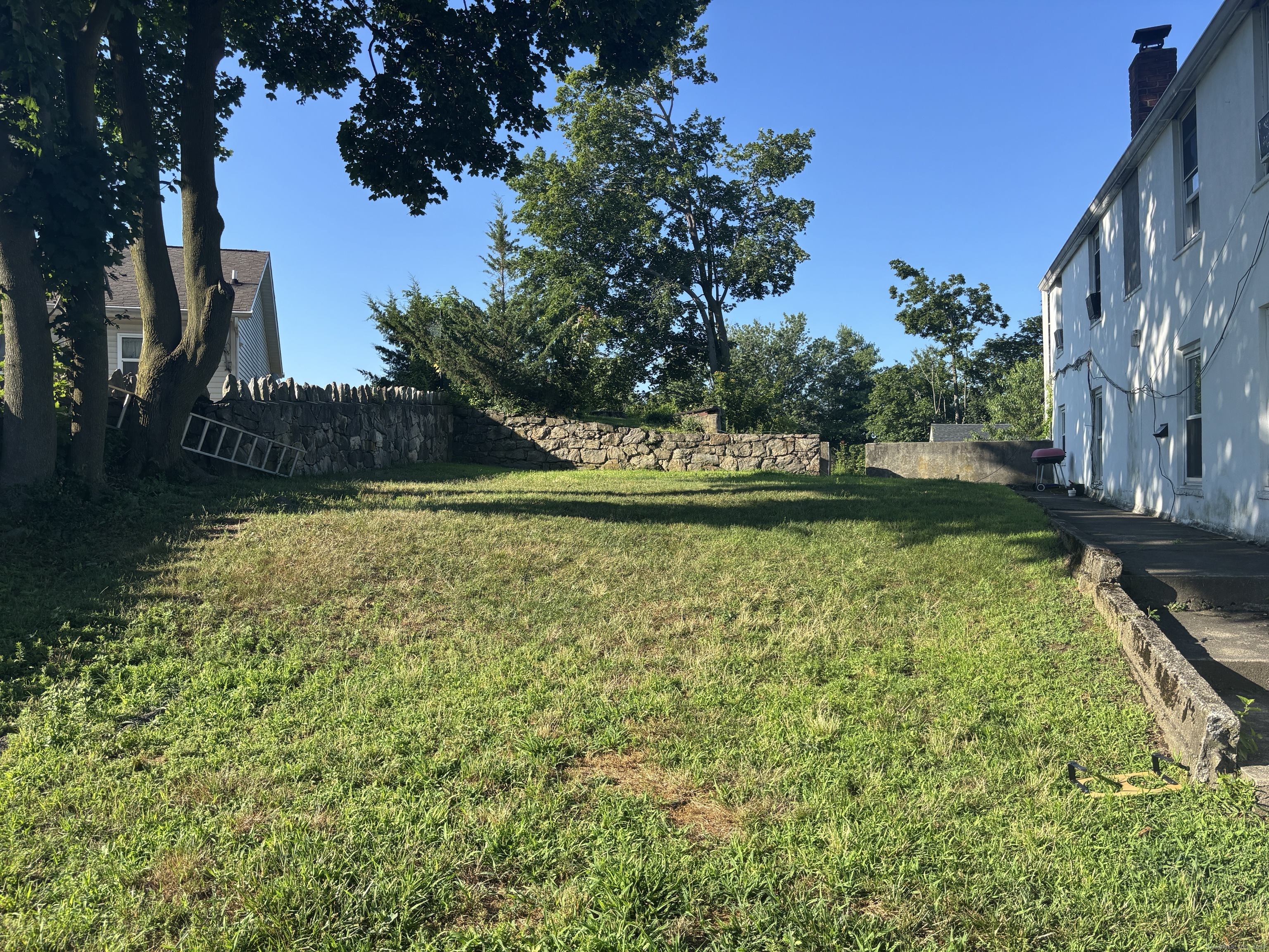 55 Bouton Street, Unit 1 Norwalk, CT 06854 - Photo 12 of 12 a view of a swimming pool with a yard
