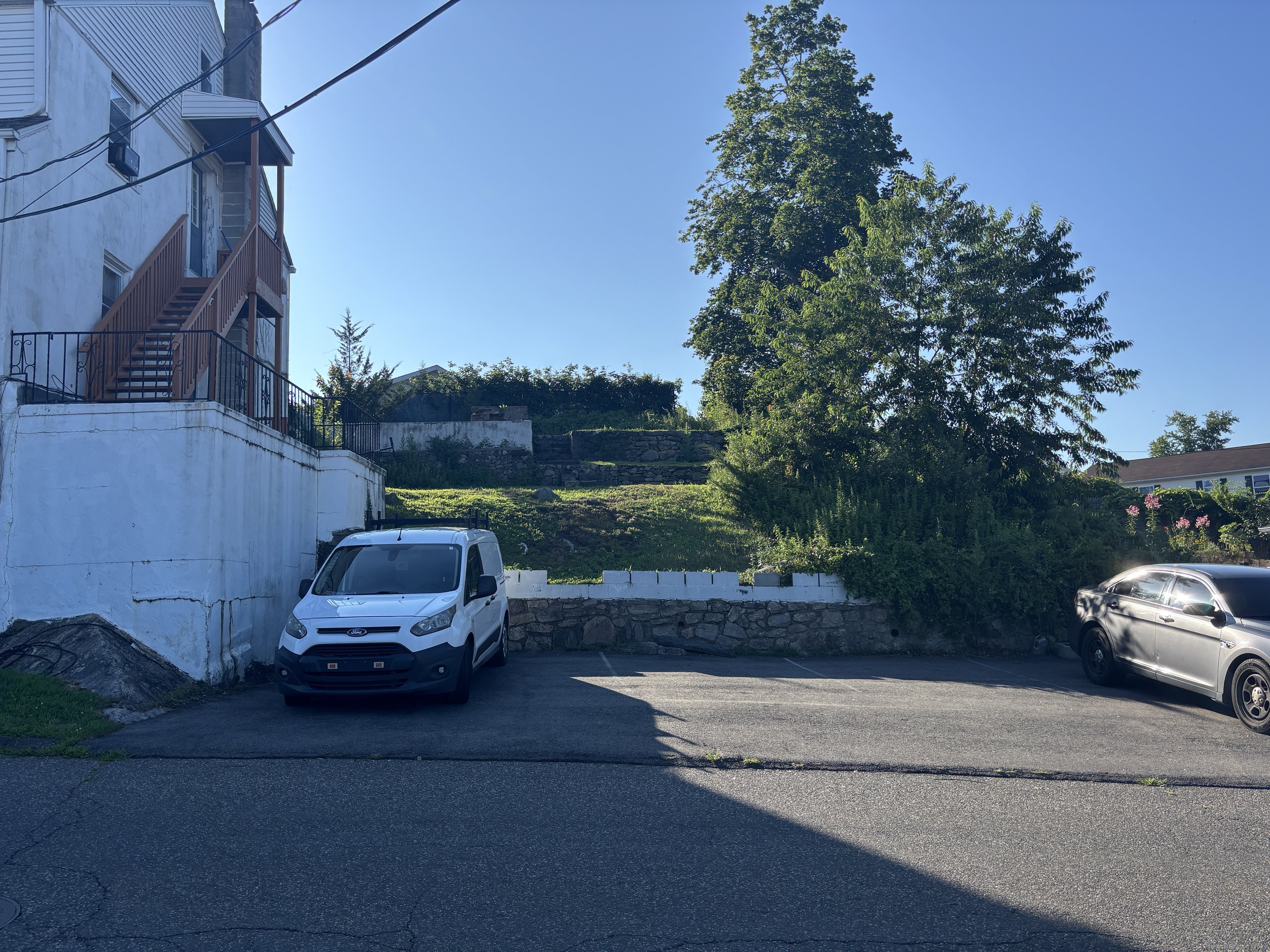 55 Bouton Street, Unit 1 Norwalk, CT 06854 - Photo 2 of 12 a car parked on the side of the road