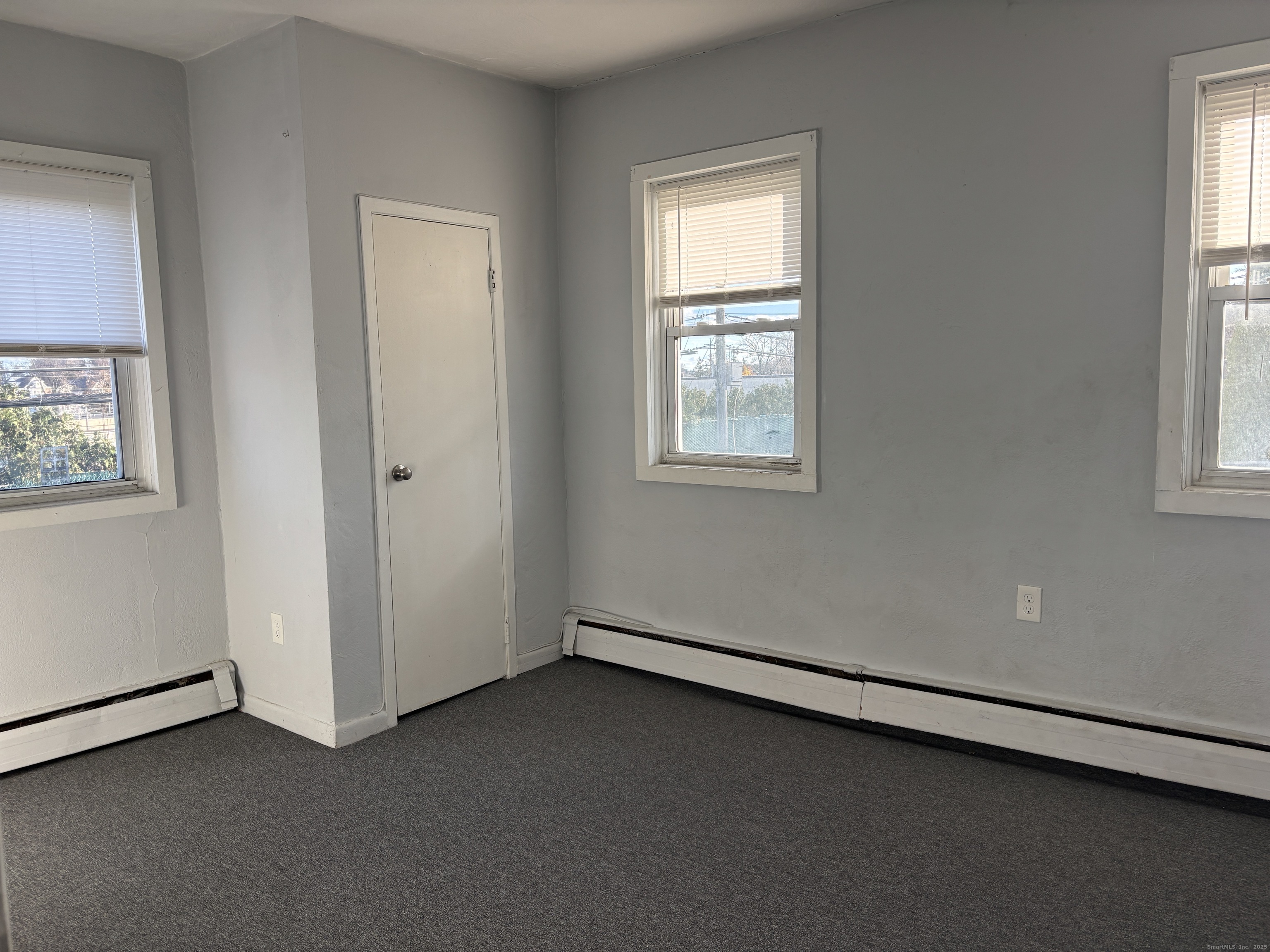 55 Bouton Street, Unit 1 Norwalk, CT 06854 - Photo 8 of 12 an empty room with windows