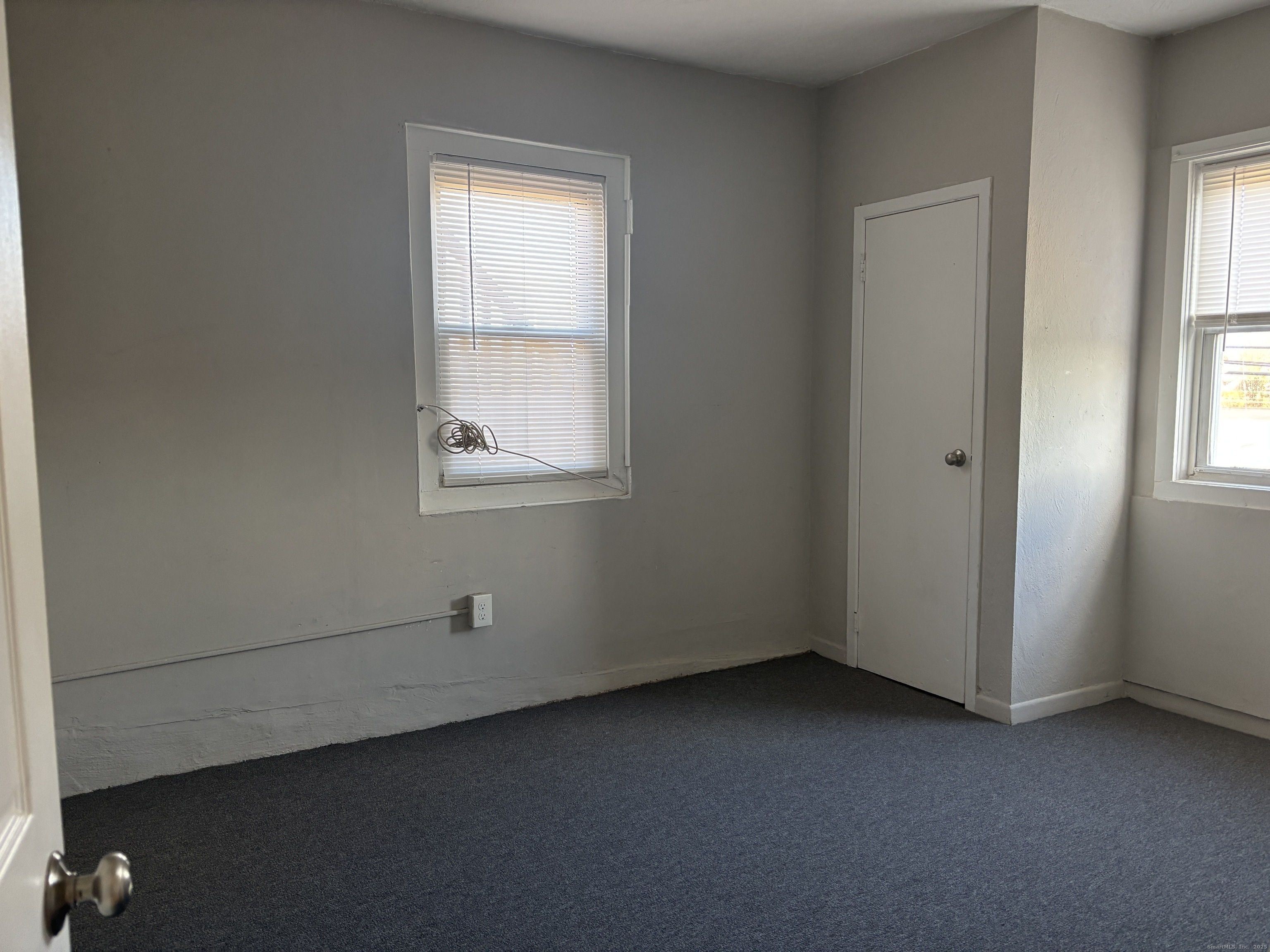55 Bouton Street, Unit 1 Norwalk, CT 06854 - Photo 9 of 12 an empty room with windows