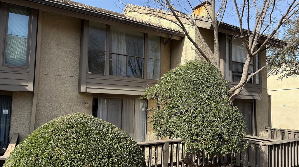 4531 North O'Connor Road, Unit 1196 Irving, TX 75062 - Photo 14 of 14 View of property exterior with stucco siding and a tile roof