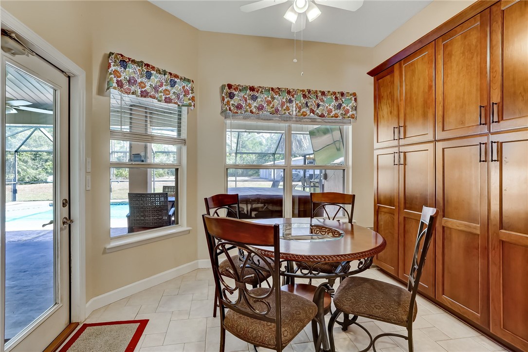 96356 Chester Road Yulee, FL 32097 - Photo 14 of 34 a view of a dining room with furniture window and outside view