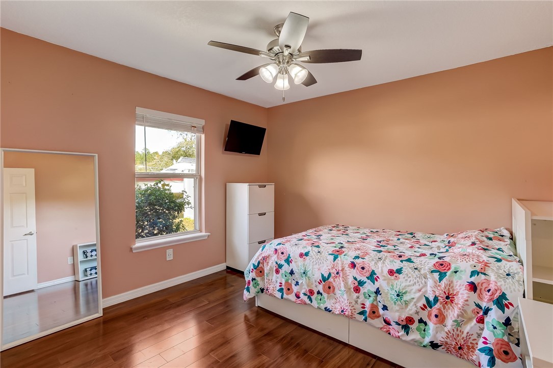 96356 Chester Road Yulee, FL 32097 - Photo 17 of 34 a bedroom with a bed and a window