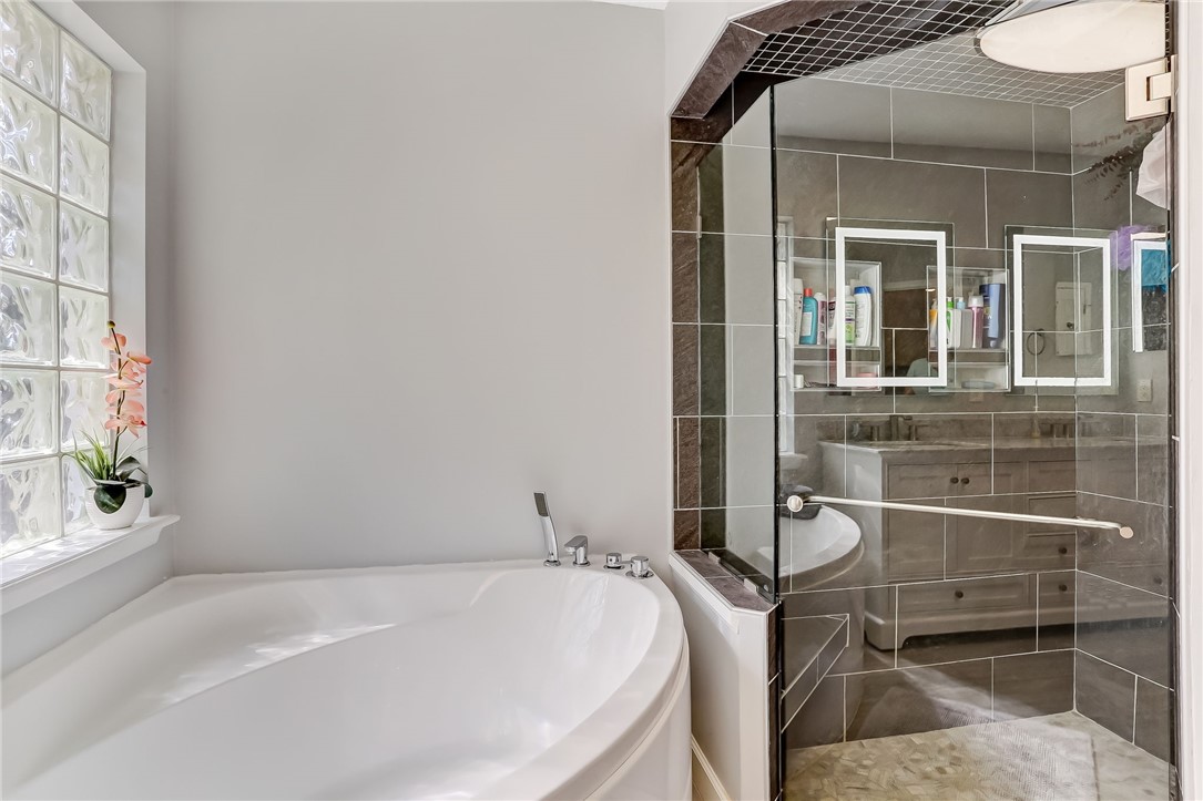 96356 Chester Road Yulee, FL 32097 - Photo 22 of 34 a bathroom with a tub and shower