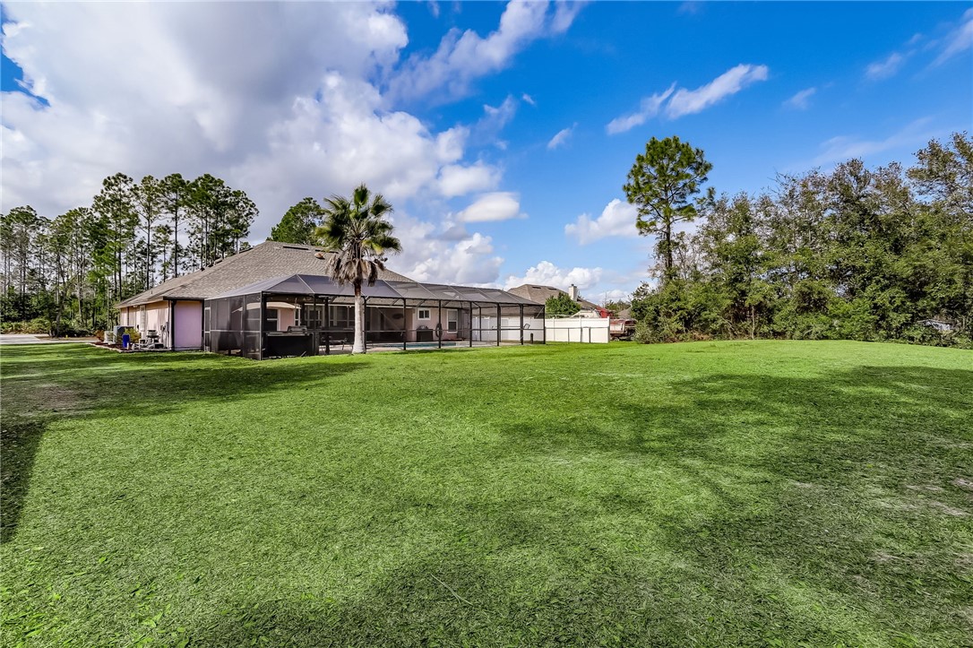 96356 Chester Road Yulee, FL 32097 - Photo 32 of 34 a front view of house with yard and green space