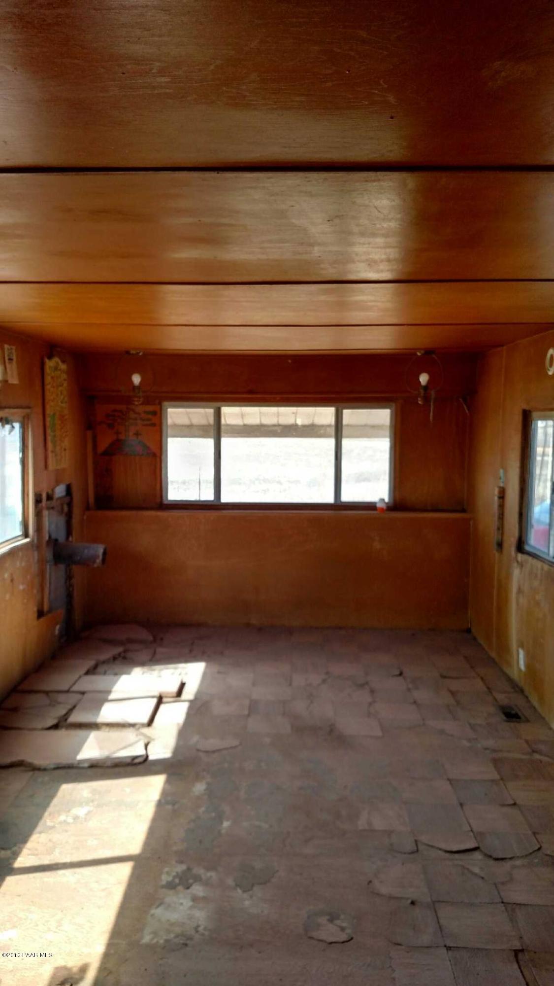 25480 North Mitchell Road Paulden, AZ 86334 - Photo 3 of 7 a view of an empty room and a window