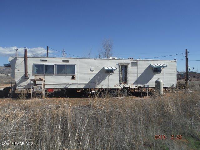 25480 North Mitchell Road Paulden, AZ 86334 - Photo 7 of 7 a view of a large building with a big yard and large trees