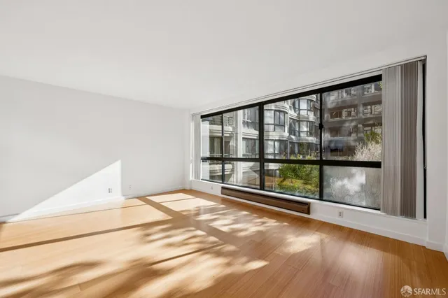a view of an empty room with a window