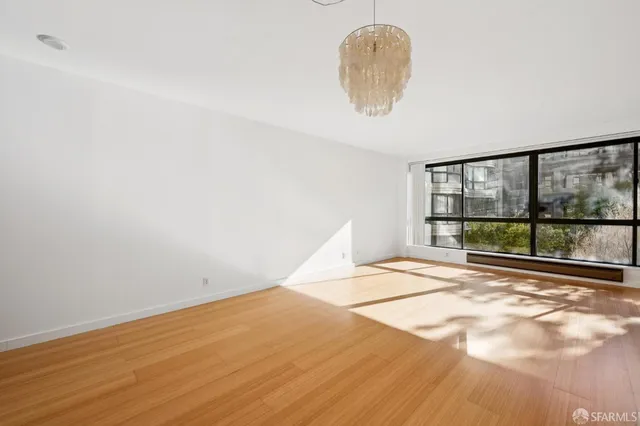 a view of kitchen and refrigerator
