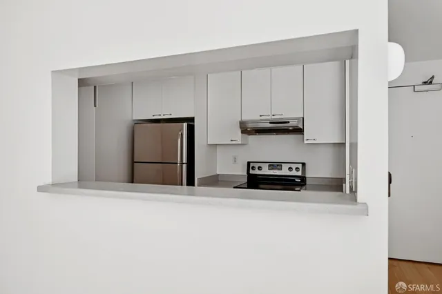 a bathroom with a window and a shower