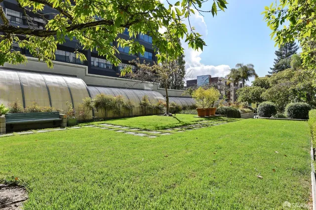a view of a brick building next to a yard