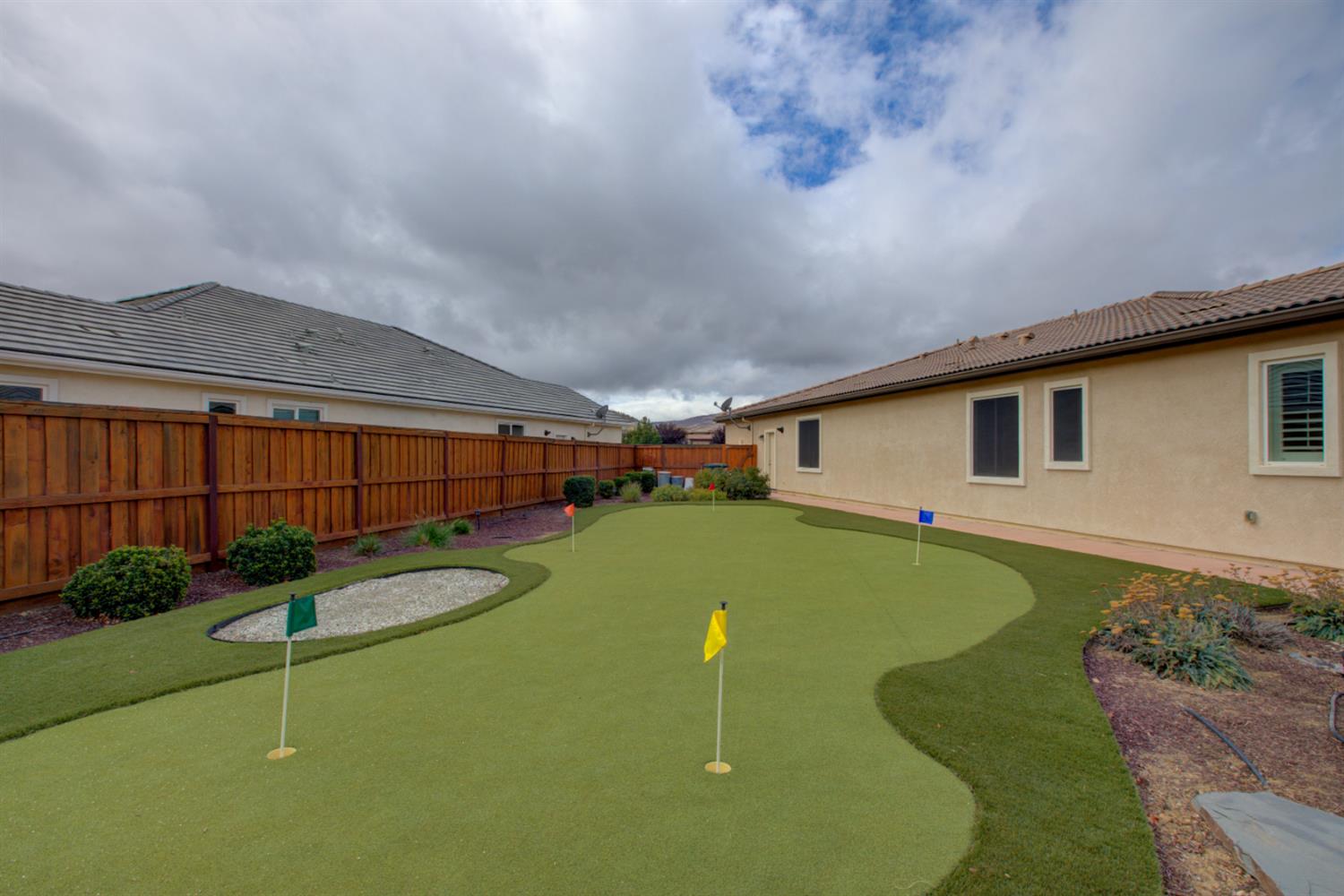 21100 Varietal Court Patterson, CA 95363 - Photo 46 of 55 a front view of house with yard and outdoor seating