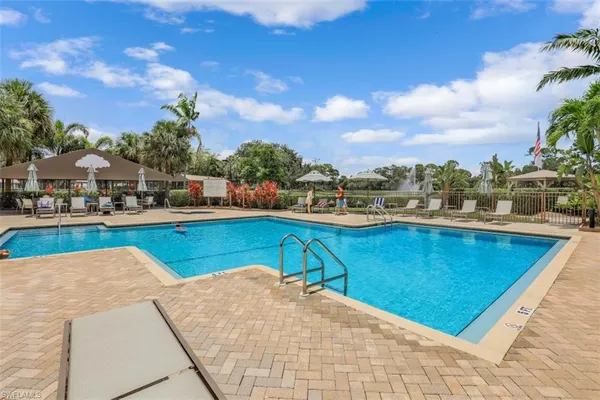 a view of a swimming pool with a lounge chairs