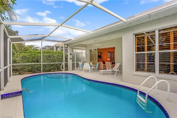 a view of swimming pool with outdoor seating