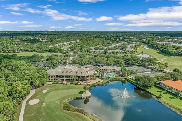 a view of a swimming pool and an outdoor seating